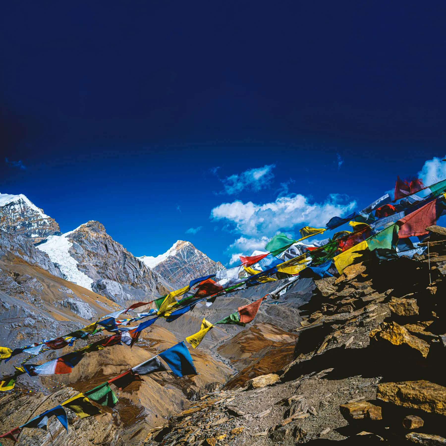 Mount Everest rising over a broad Himalayan ridgeline
